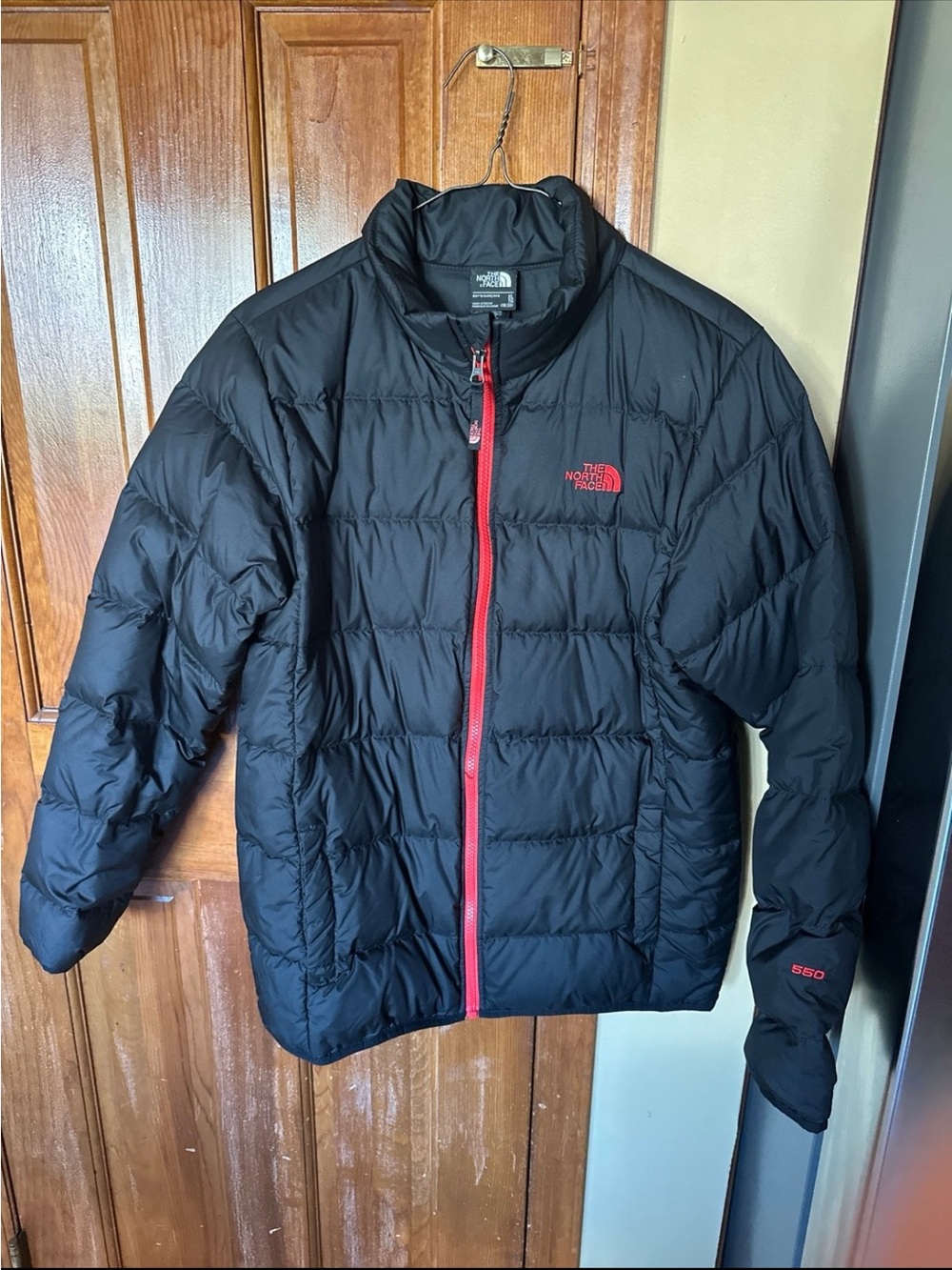 The North Face Boy’s Black Puffer Jacket with Red Trim
